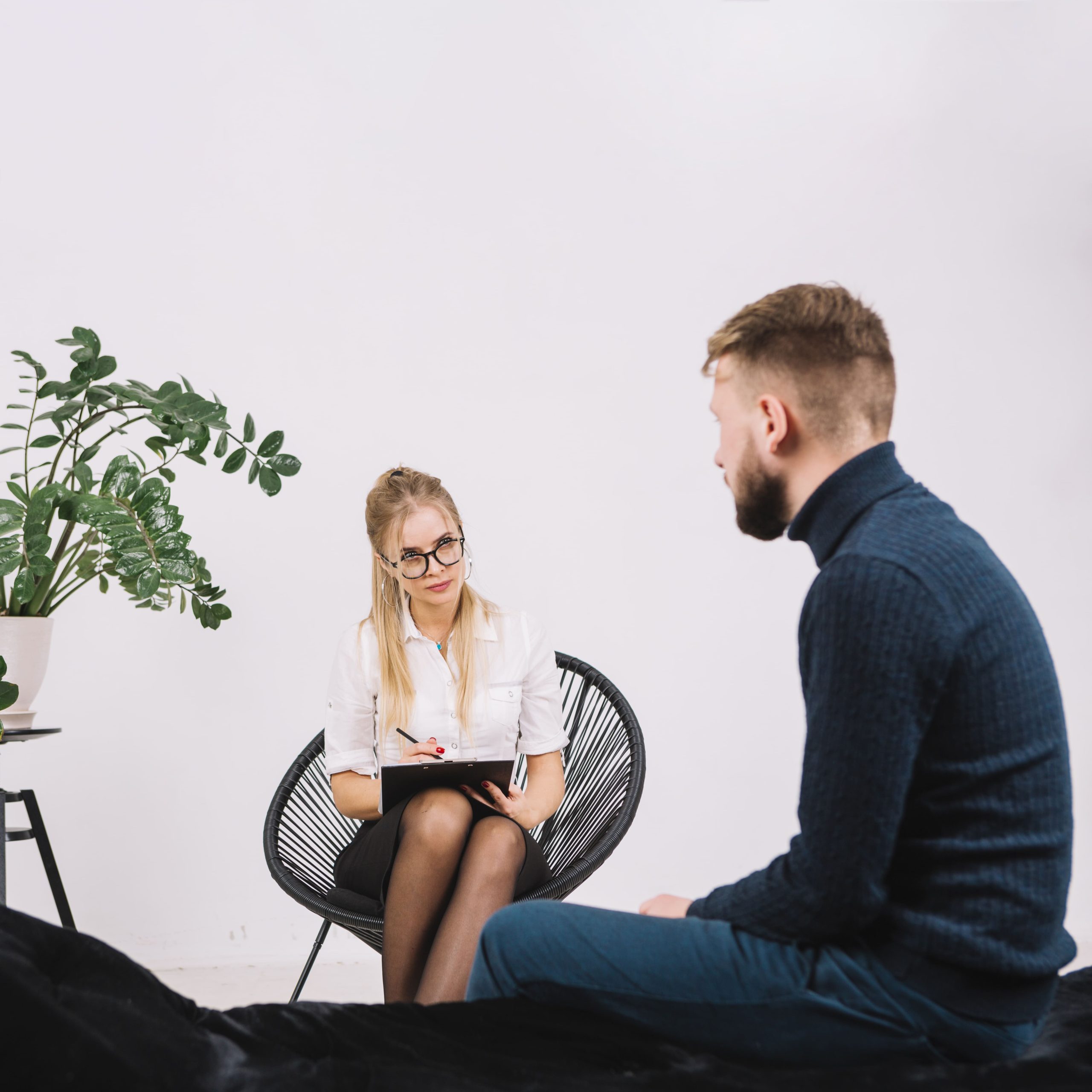 psychologist-having-session-with-her-patient-office (1)